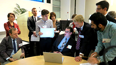Purdue team members negotiate for their standard during the competition.
