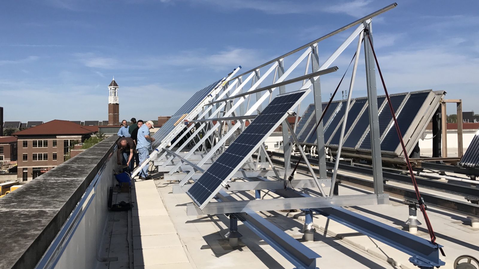 Purdue Polytechnic students and University electricians install new solar panels on Knoy's rooftop