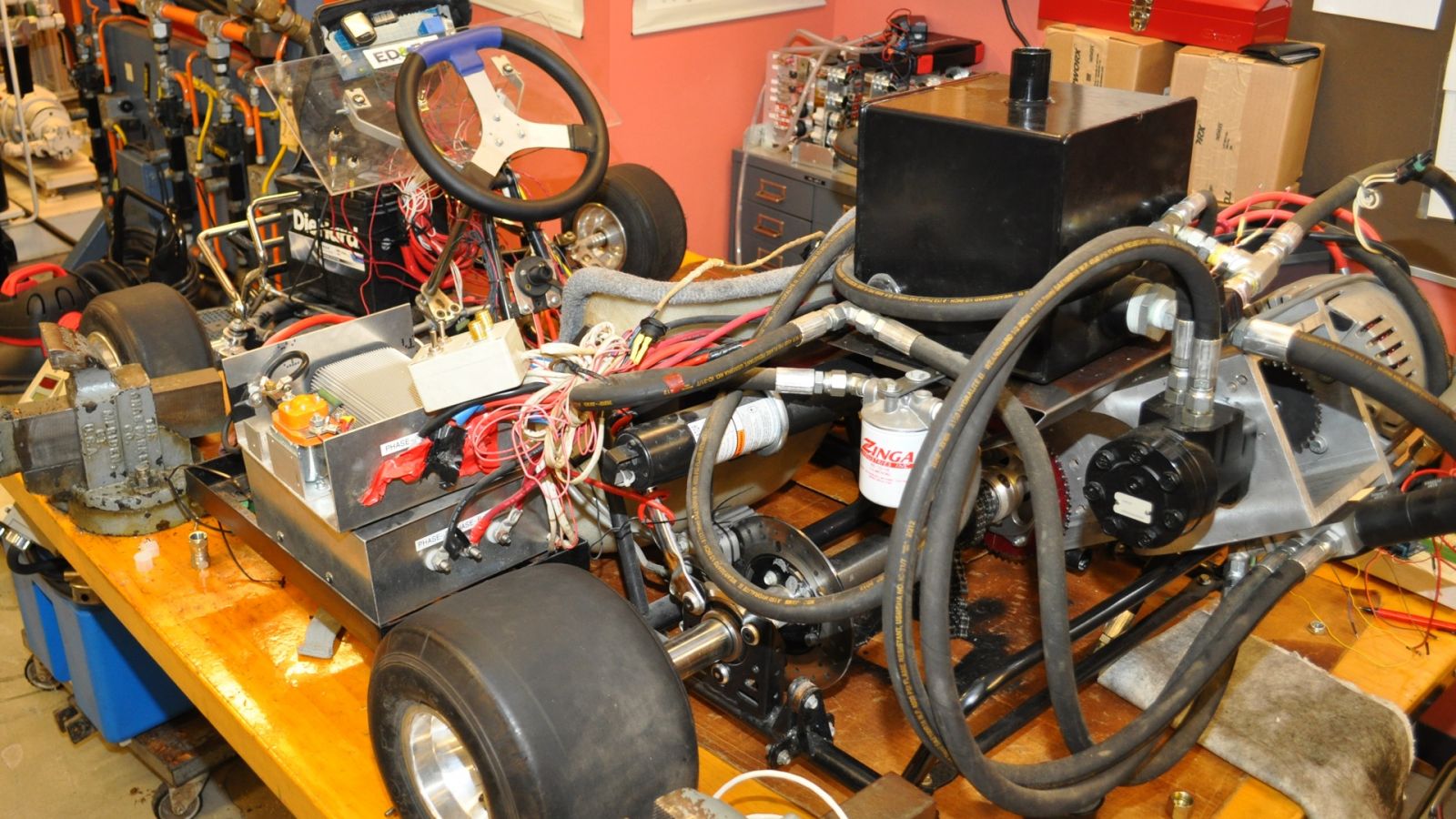 The hydraulic transmission in the go-kart is similar to that in an electric bus