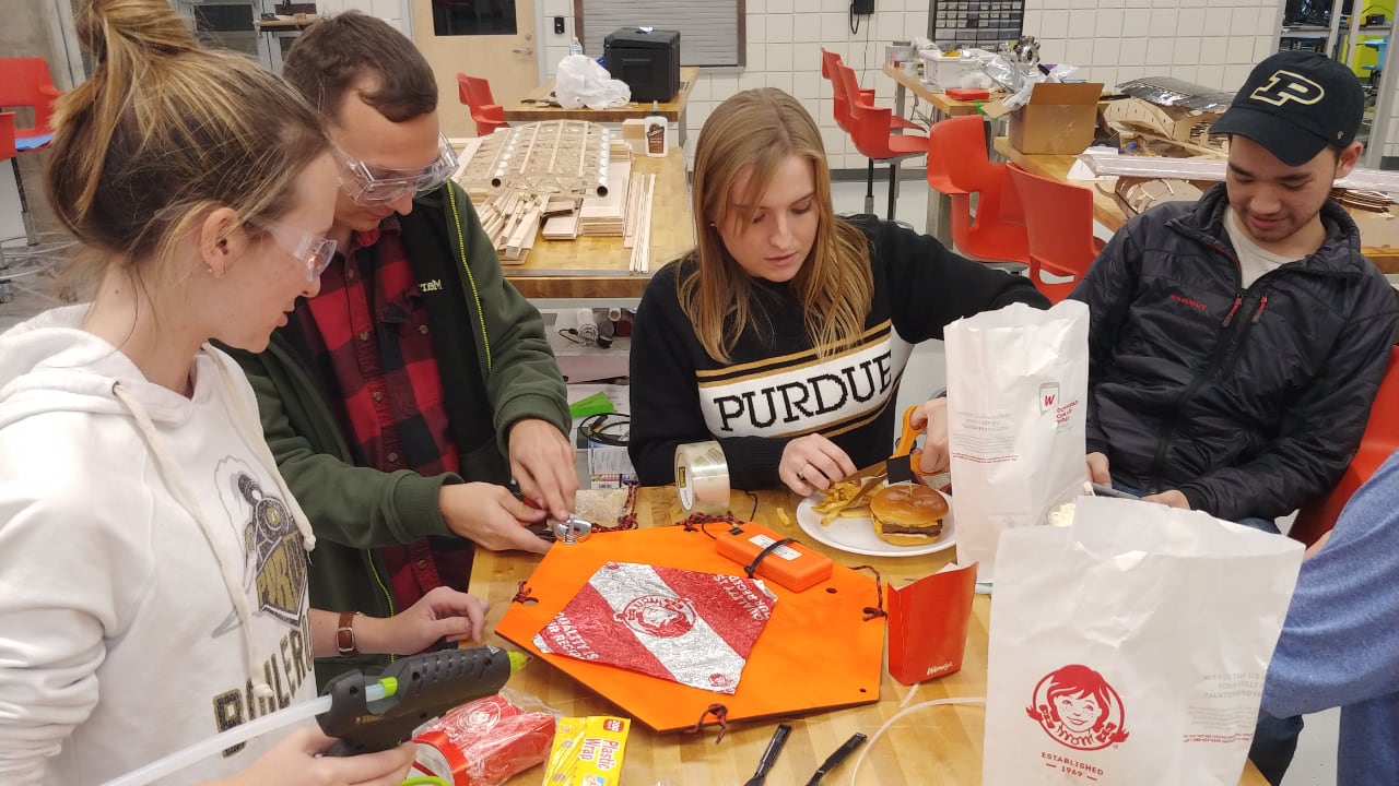 Students in Purdue AMET prepare a Wendy's Baconator & French fry payload for launch