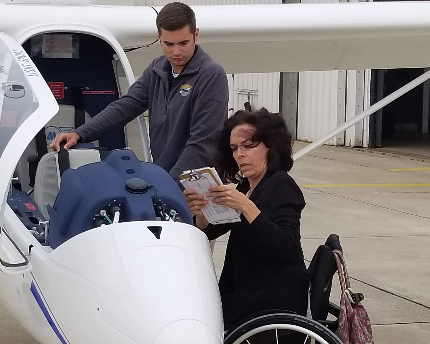 Able Flight student Emily Hupe of California goes through her pre-flight checklist last year at Purdue University Airport. (Purdue University photo/Brian Huchel)