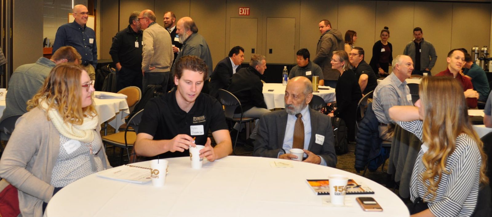 Students, faculty and industry representatives networking at the ISHE/ASHE conference