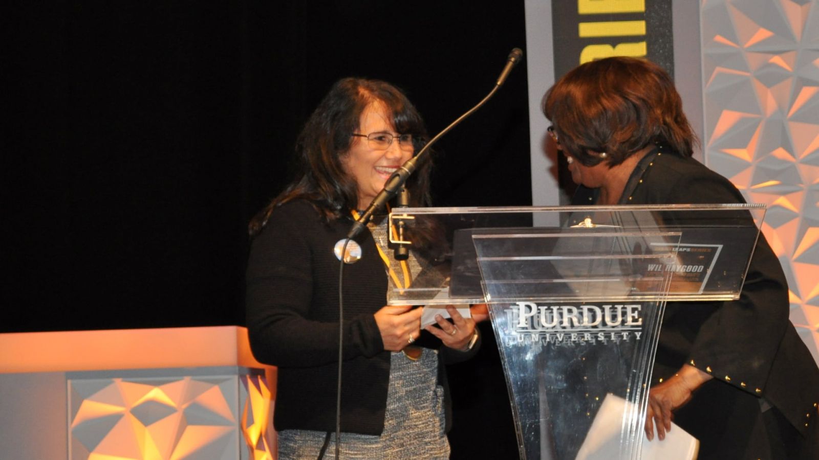 Carolyn Johnson, right, congratulates Toni Munguia on receiving the 2019 Dreamer Award