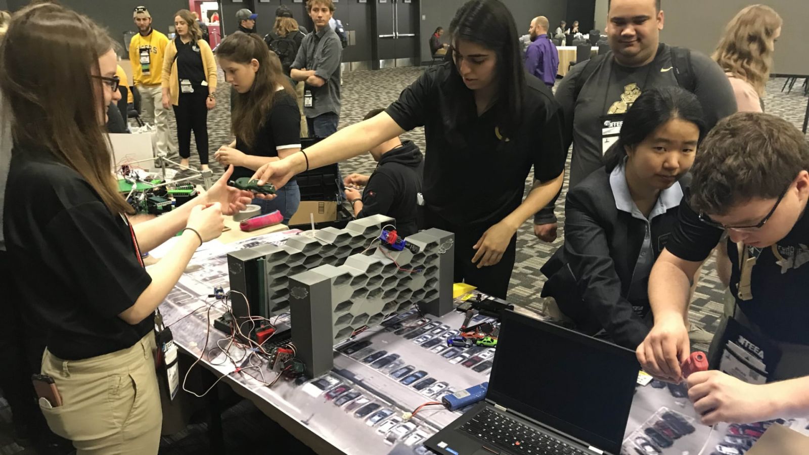 Purdue Polytechnic students Daphne Fauber, Vanessa Santana, Zach Laureano, Liwei Zhang and Brian DeRome engage their problem-solving skills at the 2019 ITEEA conference.