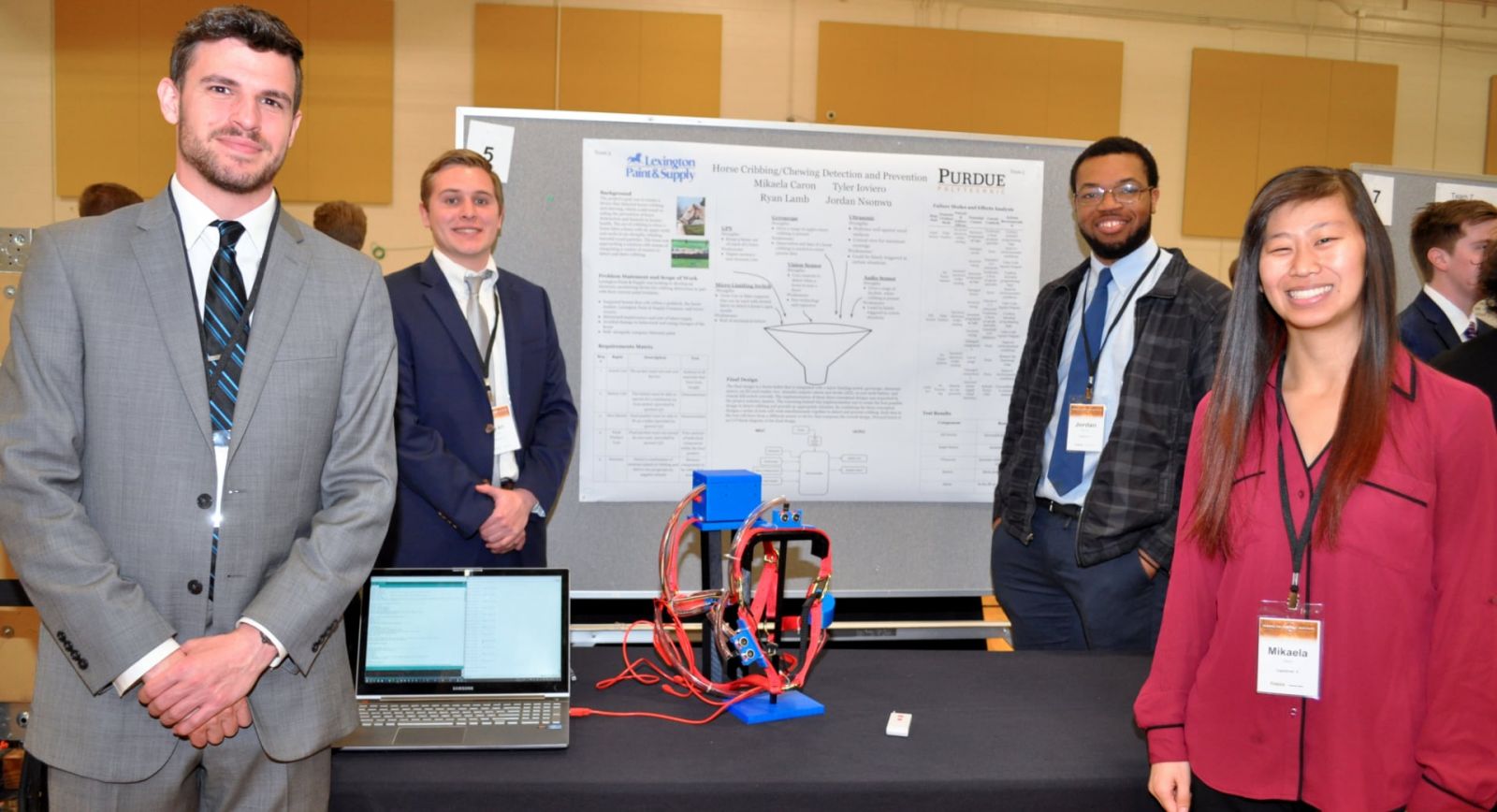 A student team poses with their senior capstone project during the 2018 Purdue Polytechnic Tech Expo
