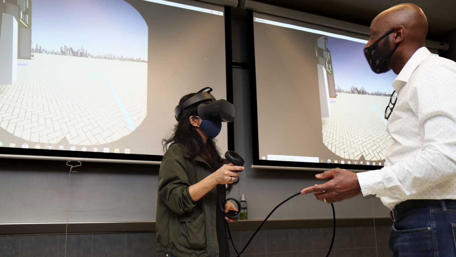  Ramyani Sengupta and Anthony Sparkling use virtual reality technology in a Knoy Hall laboratory to “walk” through Purdue’s future Engineering & Polytechnic Gateway Complex. (Purdue University photo/John O’Malley)