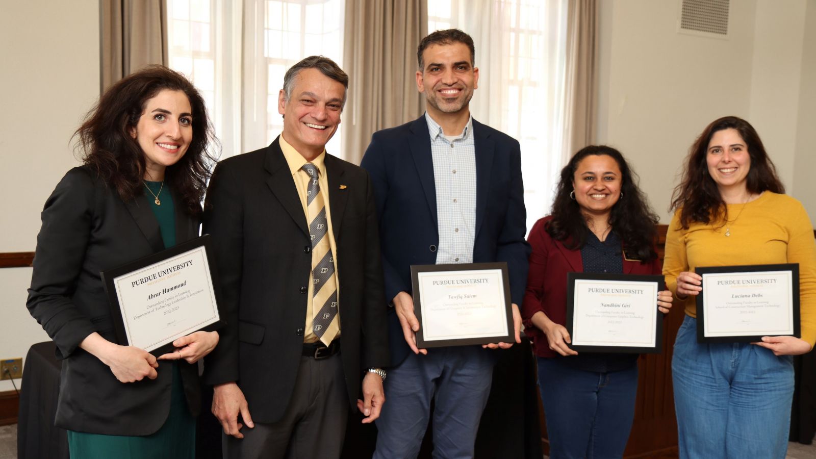 The certificate holders for Outstanding Faculty in Learning (Abrar Hammoud, Tawfiq Salem, Nandhini Giri and Luciana Debs)are pictured alongside Polytechnic Dean Daniel Castro-Lacouture. (Purdue University photo/John O'Malley)