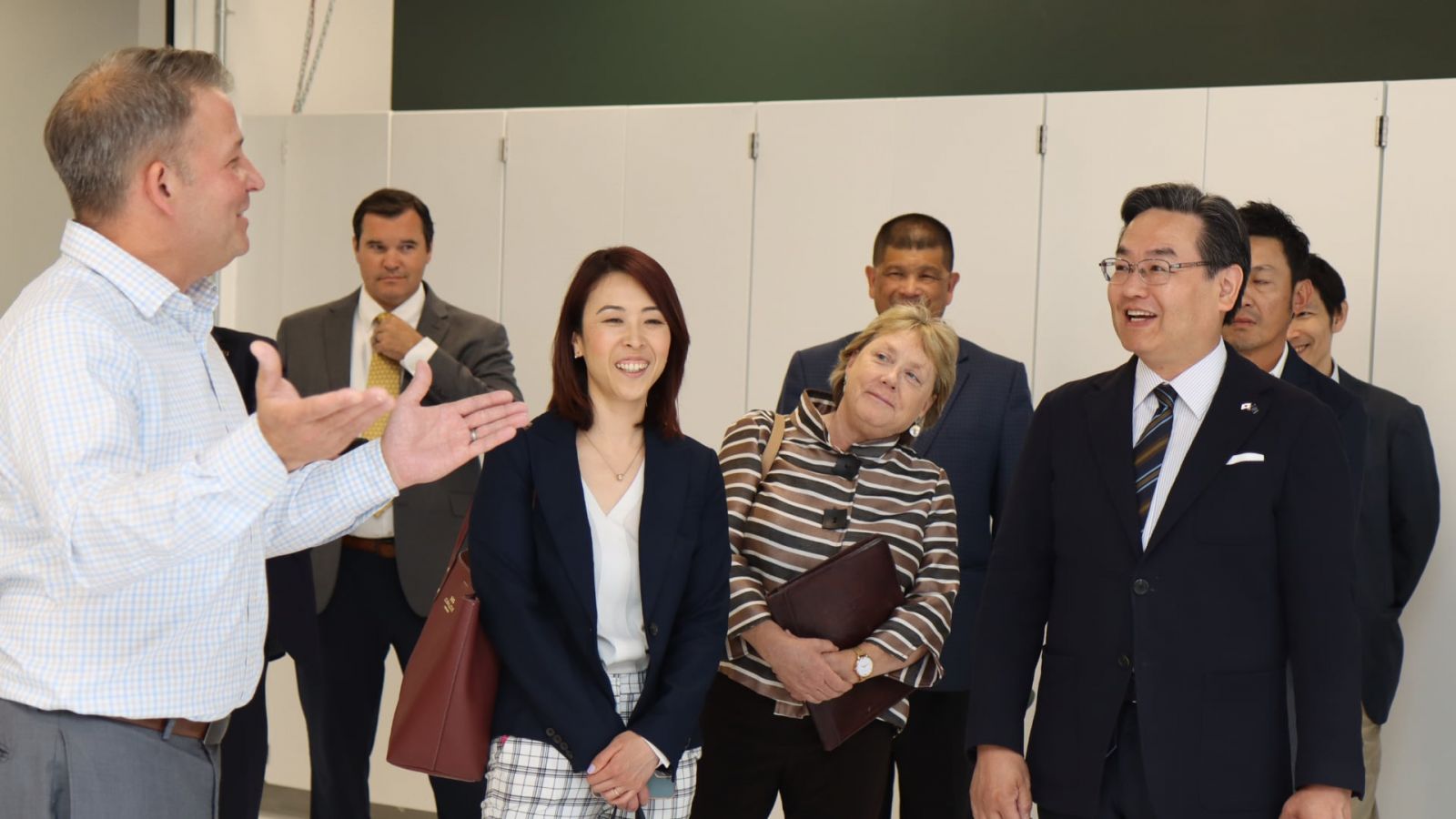 Grant Richards (left), associate professor of practice in Purdue's School of Engineering Technology, describes the new Smart Factory lab to Consul-General Hiroshi Tajima (right), the chief executive of the Japanese Consul to the Midwest. (Purdue University photo/John O'Malley)