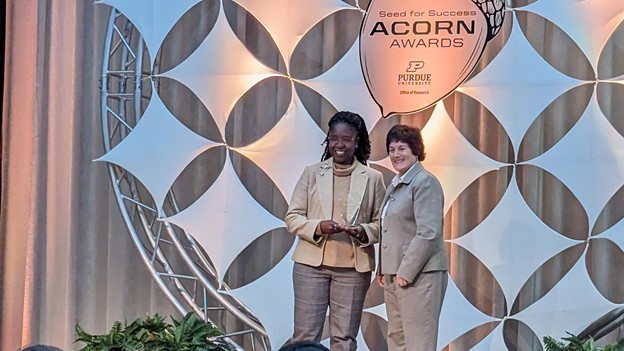 Vetria Byrd, a faculty winner from Computer Graphics Technology, with Karen Plaut, executive vice president for research. (Photo provided)