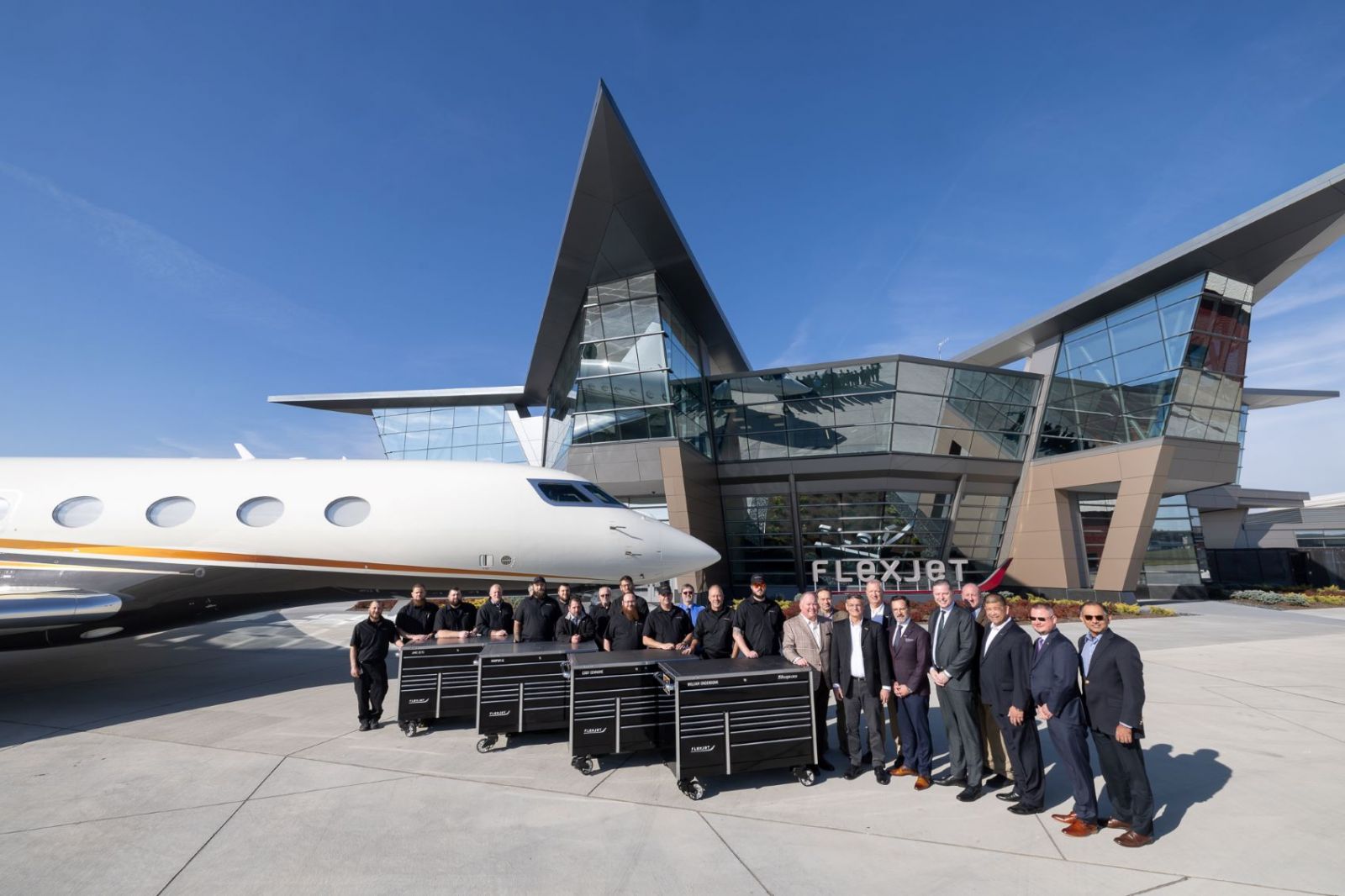 Purdue Polytechnic and Flexjet's teams gathered at the exterior of Flexjet's Richmond Heights headquarters. (Photo provided: Flexjet)